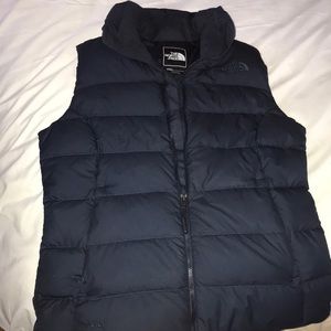 Navy blue down vest.